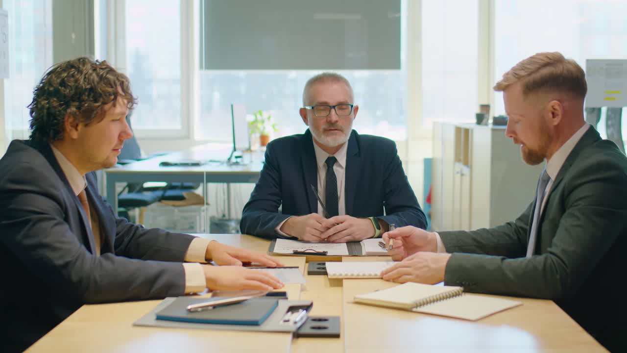 Businessmen Discussing Project on Meeting