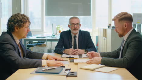 businessmen discussing project on meeting