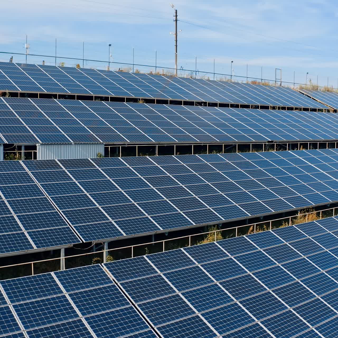 Modern constructions of sunny batteries. Blue photovoltaic solar panels get clean energy from the sun. Alternative source of eco energy