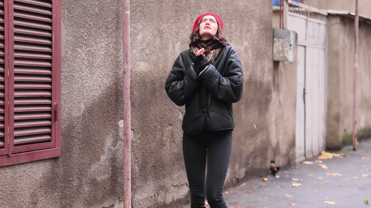 Woman in Red Beret and Black Jacket in Urban Setting