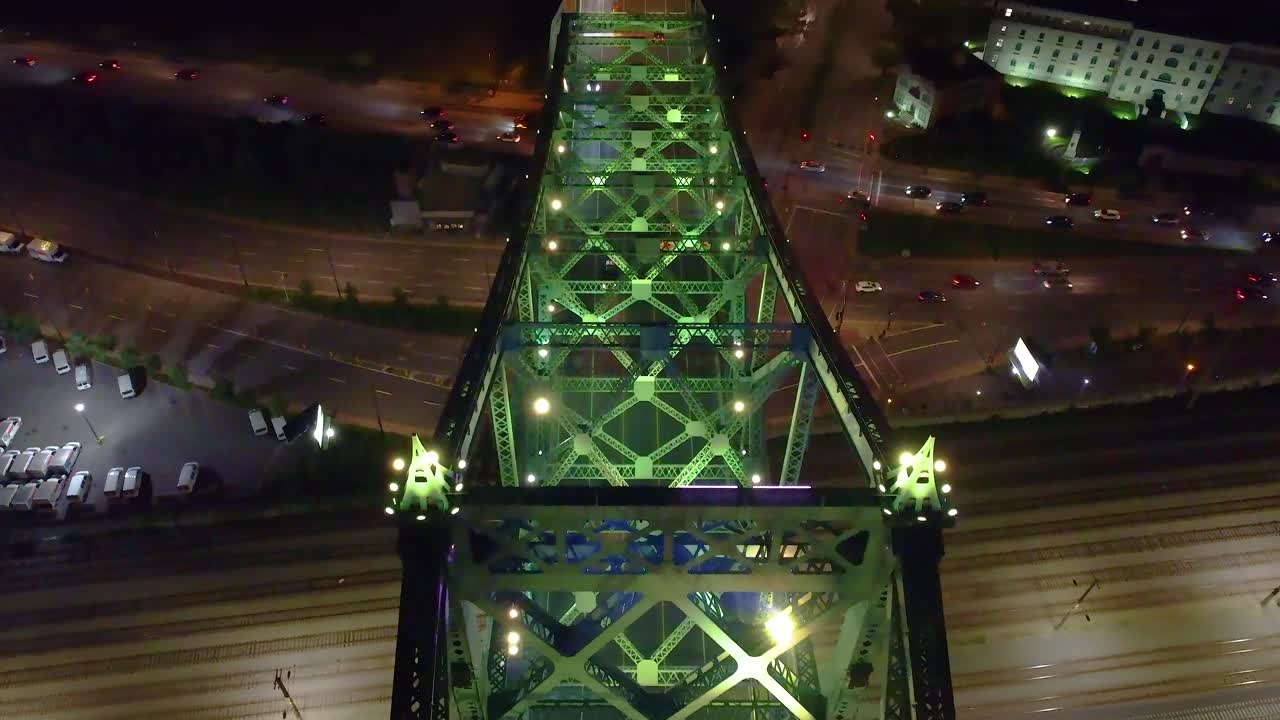 Traffic on Jacques Cartier bridge in Montreal at night. Aerial