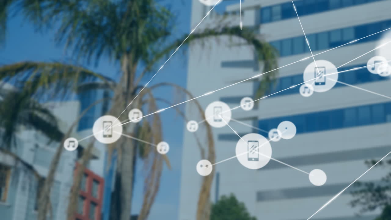 Animating media icons and connected devices over urban buildings and palm trees