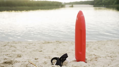 torpedo buoy on the sand