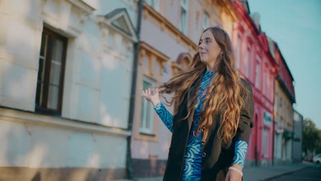 stylish woman walking down a colorful european street