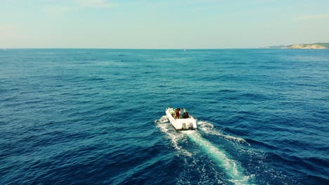 slowmotion-aerial,-boat-cruising-in-Mexico-ocean-near-Huatulco-shore,-luxury-cruise-at-sea