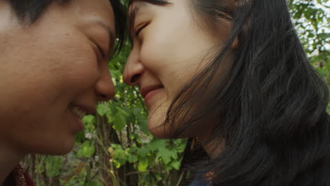 romantic asian lesbian couple bonding in nature