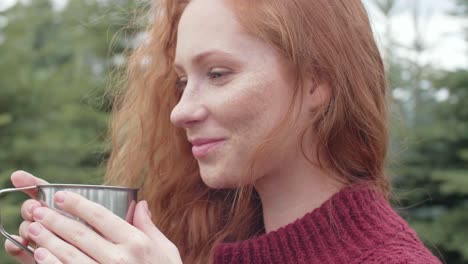 tourist drinking tea in forest