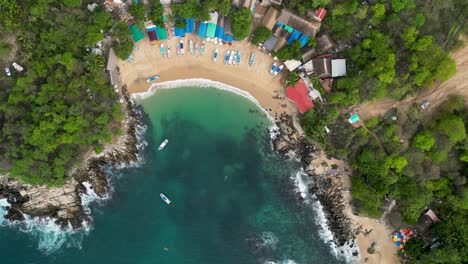 Puerto-Angelito-beach-a-bird's-eye-view-of-azure-waters-and-golden-sands-at-Puerto-Escondido,-Oaxaca,-Mexico