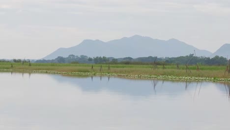 Lake-and-Mountains,-Bueng-Boraphet-Lake-and-Swamp,-Nakhon-Sawan,-Thailand