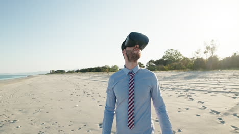 businessman wearing vr headset on a beach