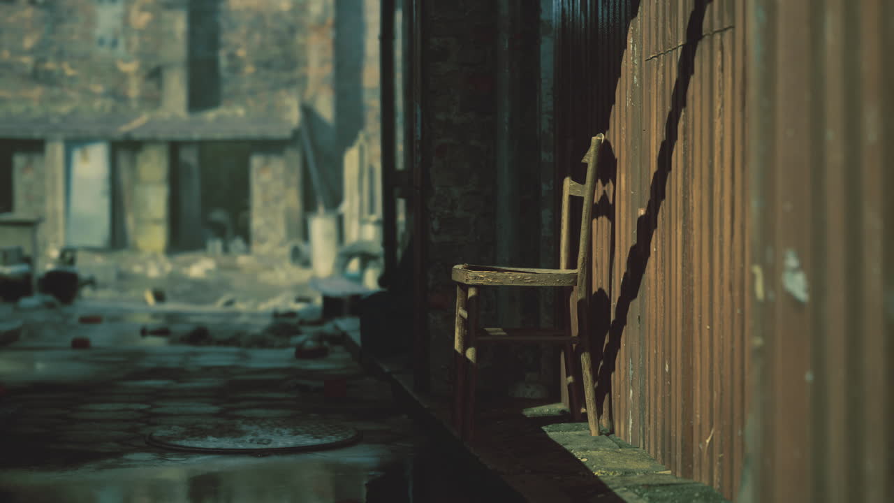 Wooden chair stands alone in a dimly lit alleyway of an abandoned building
