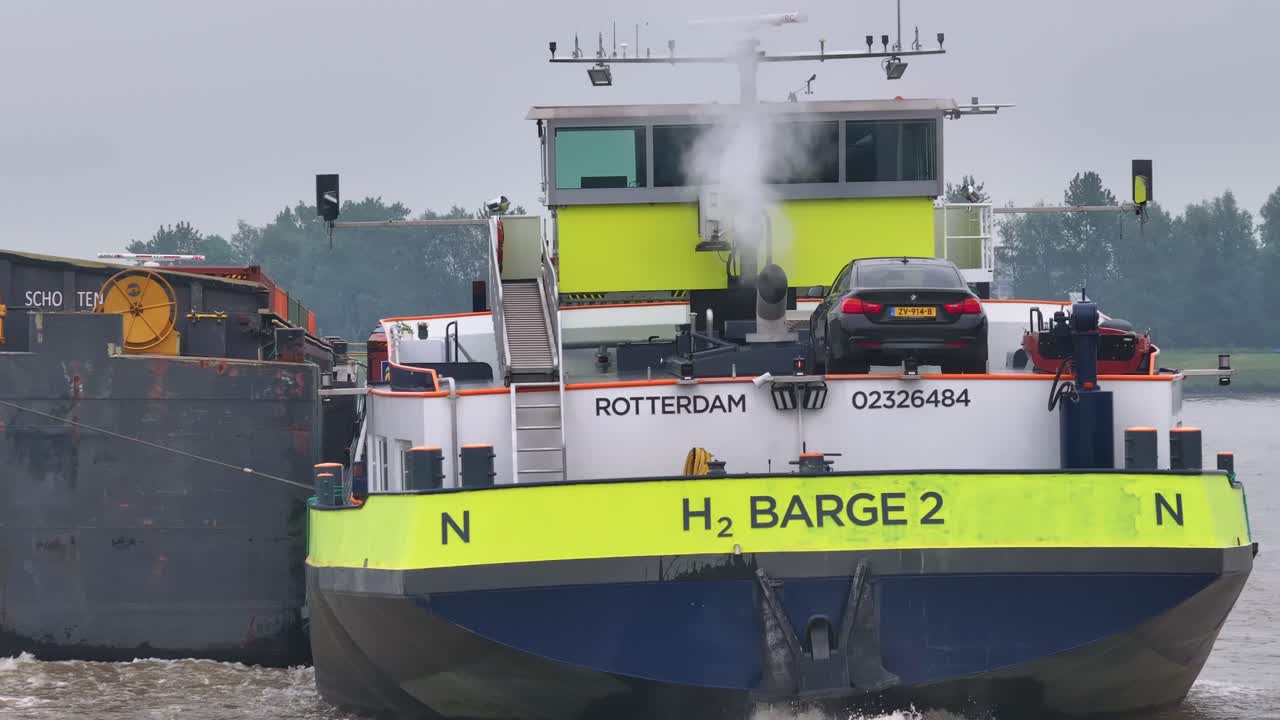 H2 Barge 2 transporting a car on a river with exhaust steam