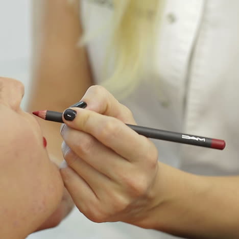 permanent make-up on her lips. portrait of lovely young woman getting permanent makeup on her lips