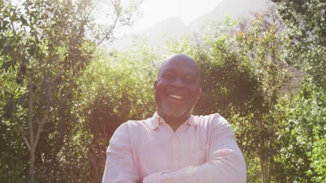 Happy-african-american-senior-man-looking-at-camera-outdoors