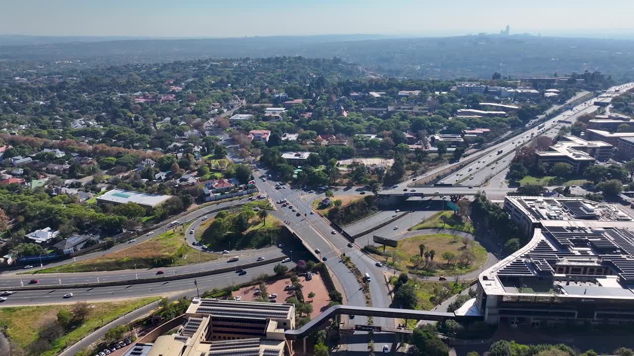 Aerial view of a city with a highway
