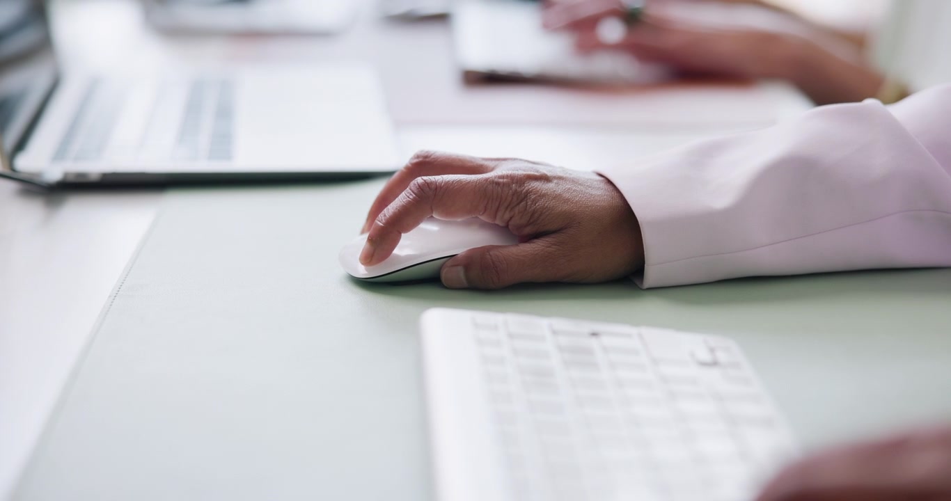 Close-up of Professional Using Computer Mouse in Office