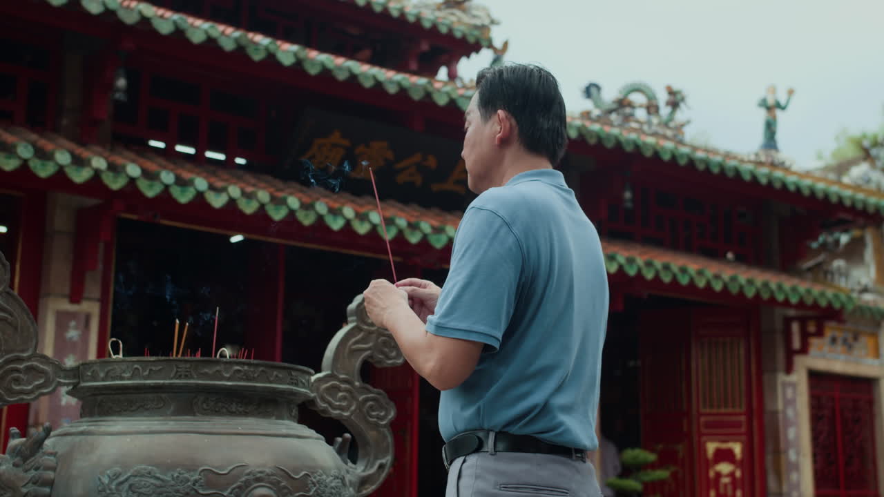 Religious Man Visiting Temple for Prayer in Asia