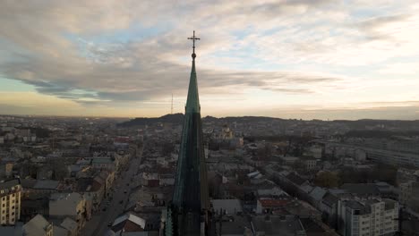 Aerial-backwards-dolly-shot-of-Church-spire-in-Lviv