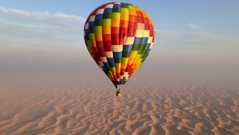 hot air balloon flight over desert dunes