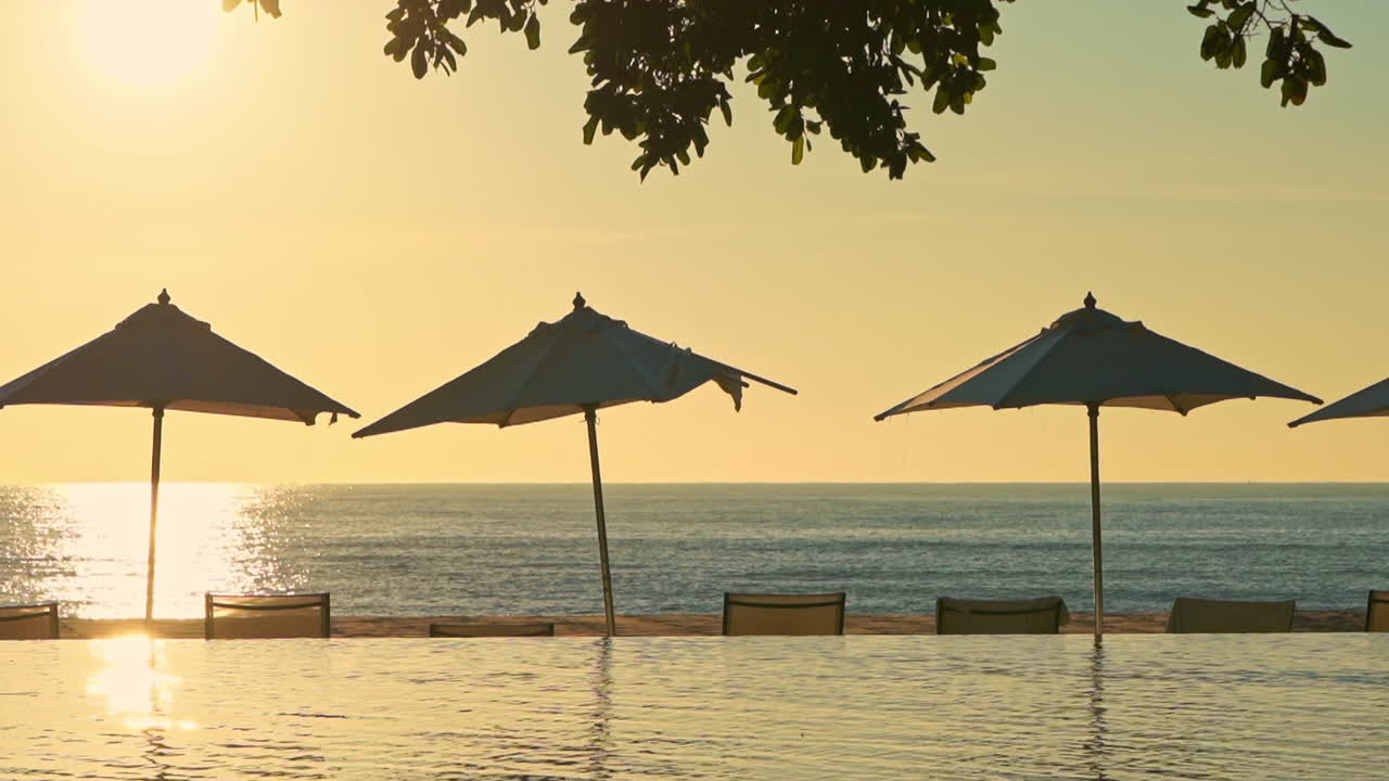 View of the ocean horizon from the edge of a resort infinity pool