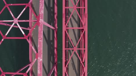 biking across shimanami kaido bridges, aerial top down view, japan