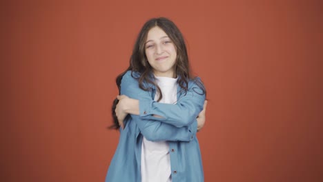 the young woman hugs the camera.