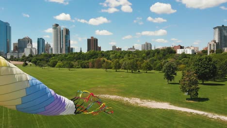 windsock patterned in rainbow colors set with the milwaukee skyline in the background