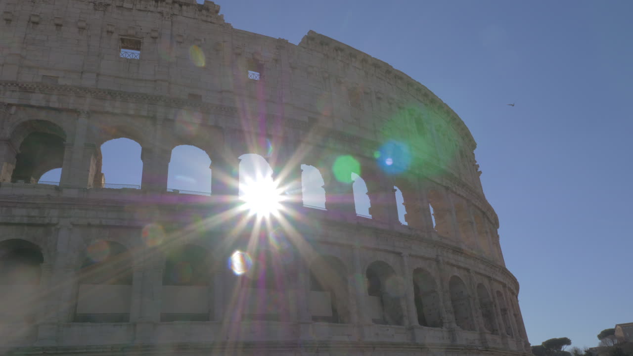 Roman Coliseum ruins in bright sunrays