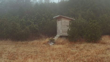 Small-Wooden-Structure-In-The-Middle-Of-Misty-Green-Forest-Mountains-Of-Beleg-In-Serbia