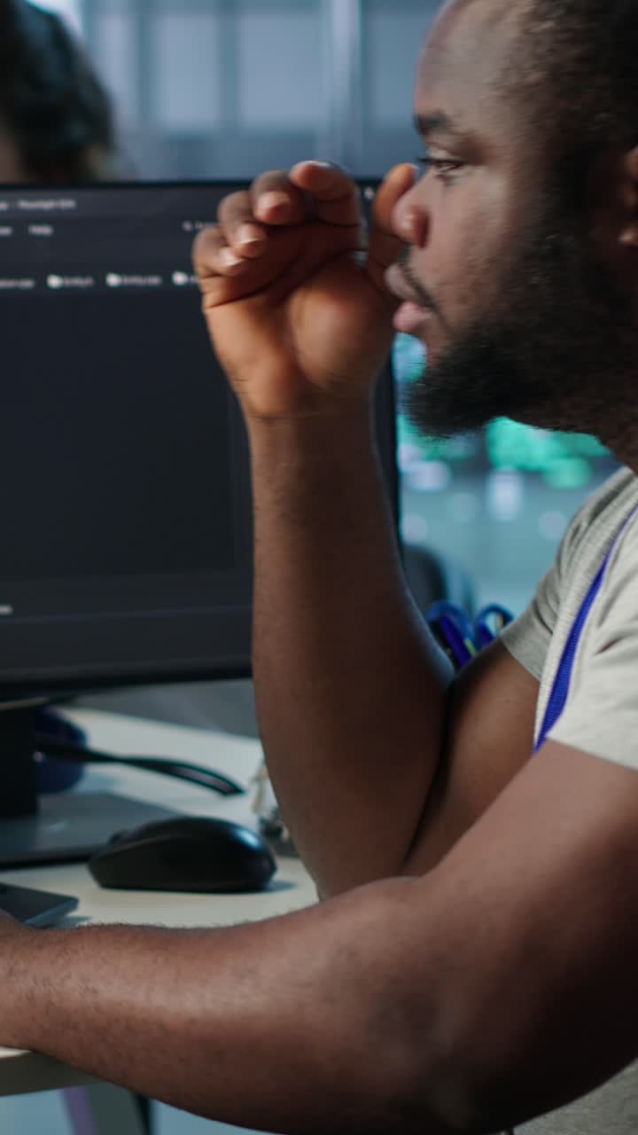 Tired African American Programmer Working on Computer in Office