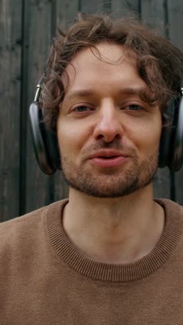 man listening to music with headphones