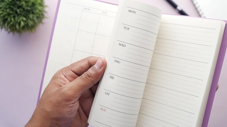 Person holding an open planner