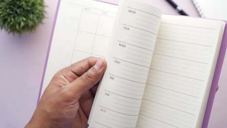 person holding an open planner