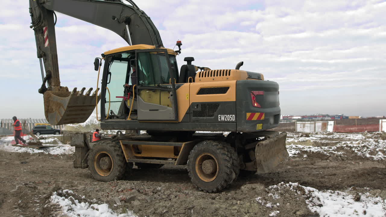 Excavator at a winter construction site