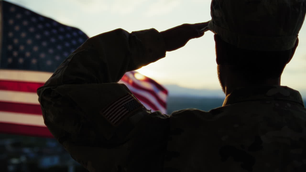 Silhouette Of A Soldier Salutes In Front Of The American Flag Memorial Day