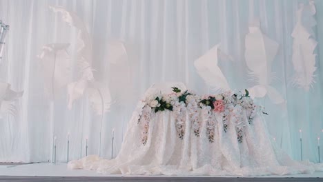 elegant wedding table decor with paper feathers and flowers