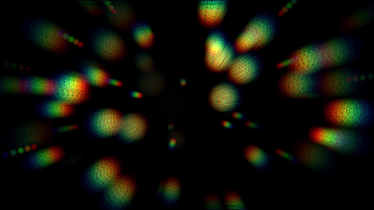 Abstract Motion Background with Glowing Rainbow Colored Particles