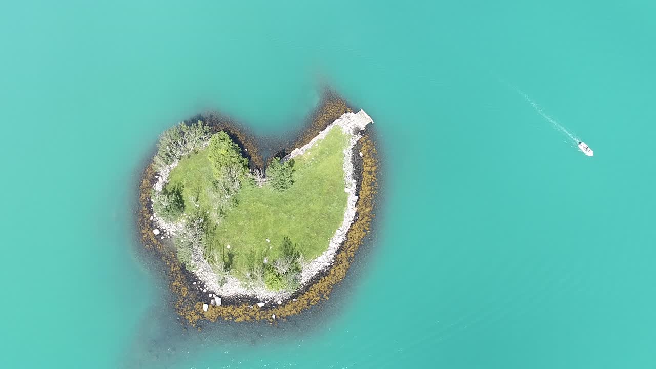 Little heart shape Ireland  on a green water with little boat