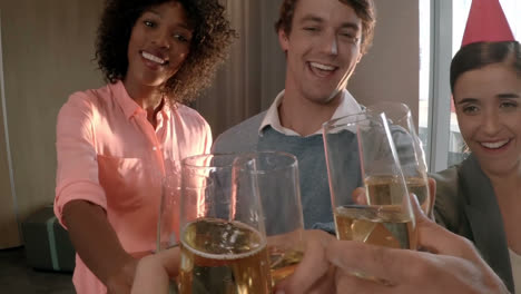 group of business executives toasting glass of champagne