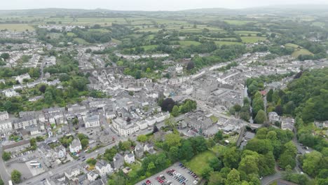 Aerial-view-of-Tavistock,-capturing-the-blend-of-residential-buildings,-green-landscapes,-and-rural-charm,-Devon,-UK