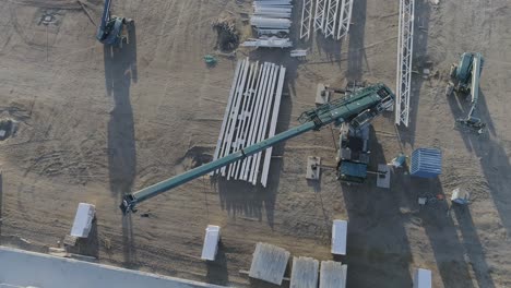 drone shot of a crane on a construction site