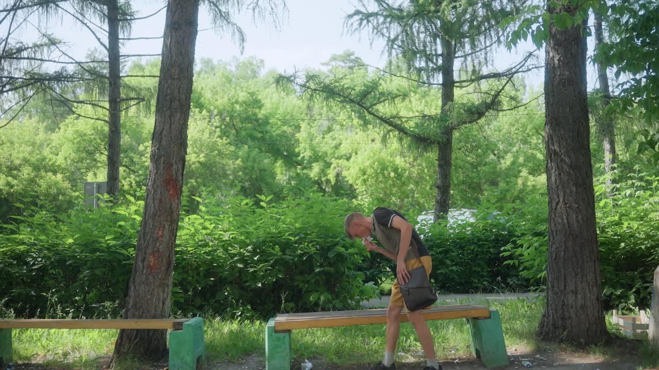 Runner Pauses Calmly, Man Finds Calmness On Bench Following Energetic Outdoor Exercise Session, Runner Takes Moment Of Stillness Amidst Quiet Trees After Strenuous Jog Through Park