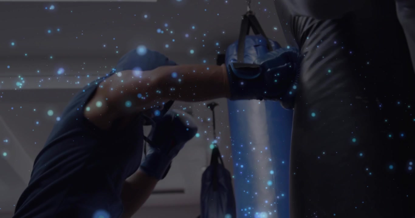 Man reaching gloved hand to bag starting boxing landing jabs hooks trainer holding blue dots moving