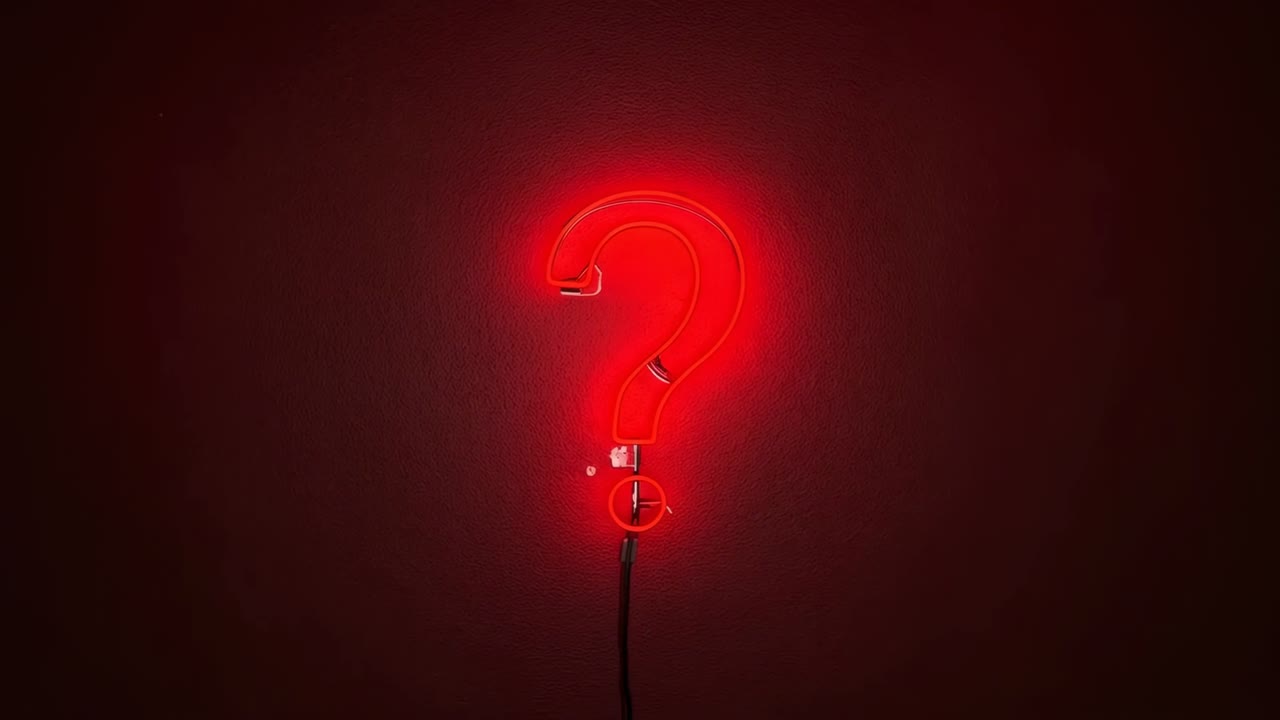 Flickering red neon ? brightening on wall, showing lower dot, bracket and cord, lighting alcove