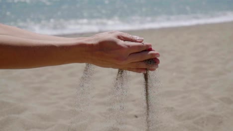 Stream-of-sand-pouring-from-hands