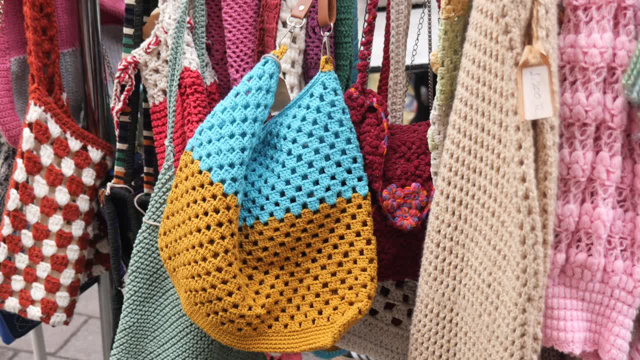 Display of Handmade Crochet Bags at a Market