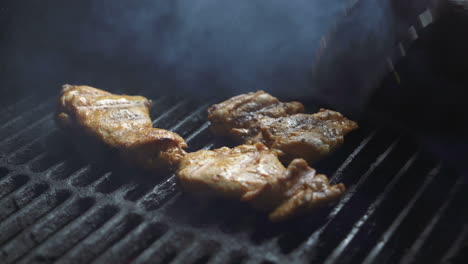 preparation of delicious succulent meat steaks on the grill. barbecue from charcoal.