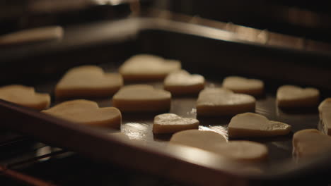 heart-shaped cookies on baking sheet