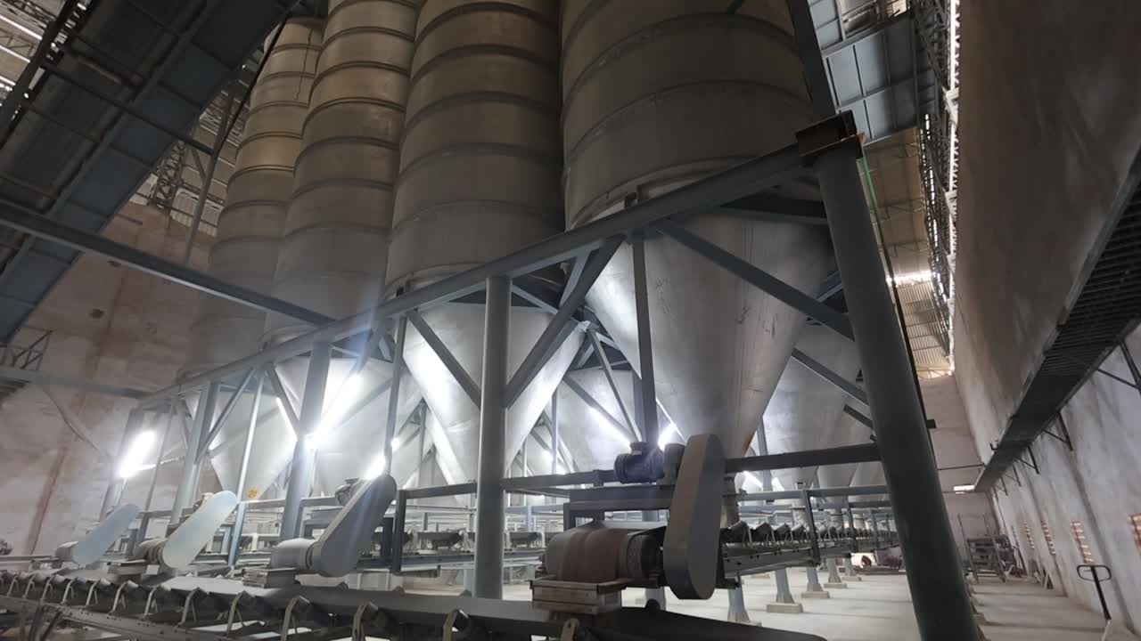 Industrial Silos and Conveyor Belts in a Large Factory
