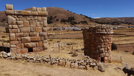 a stunning panoramic view of the ancient stone funerary monuments of chullpas de molloco near acora, peru, highlighting their historical significance in the andean landscape